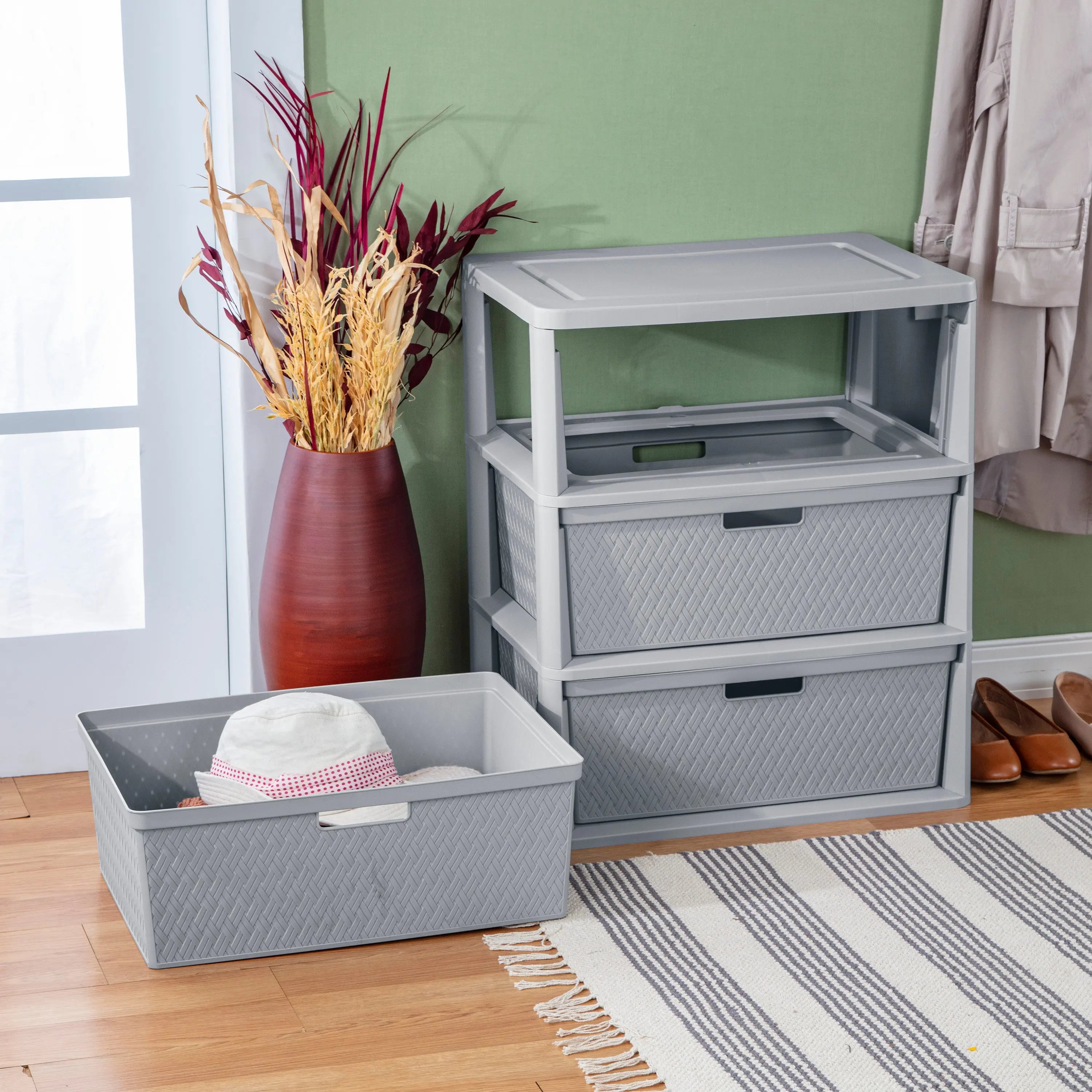 Portable Sterilite drawer being carried by integrated handles
